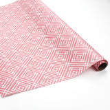 a roll of wrapping paper with a geometric lattice pattern in pink
