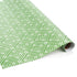 Rolls of wrapping paper with a geometric lattice pattern in green