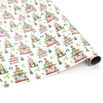Roll of pagoda-themed Christmas wrapping paper with festive green, red, and white pattern.