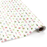 Roll of white wrapping paper with colorful Christmas ornament and holly pattern.
