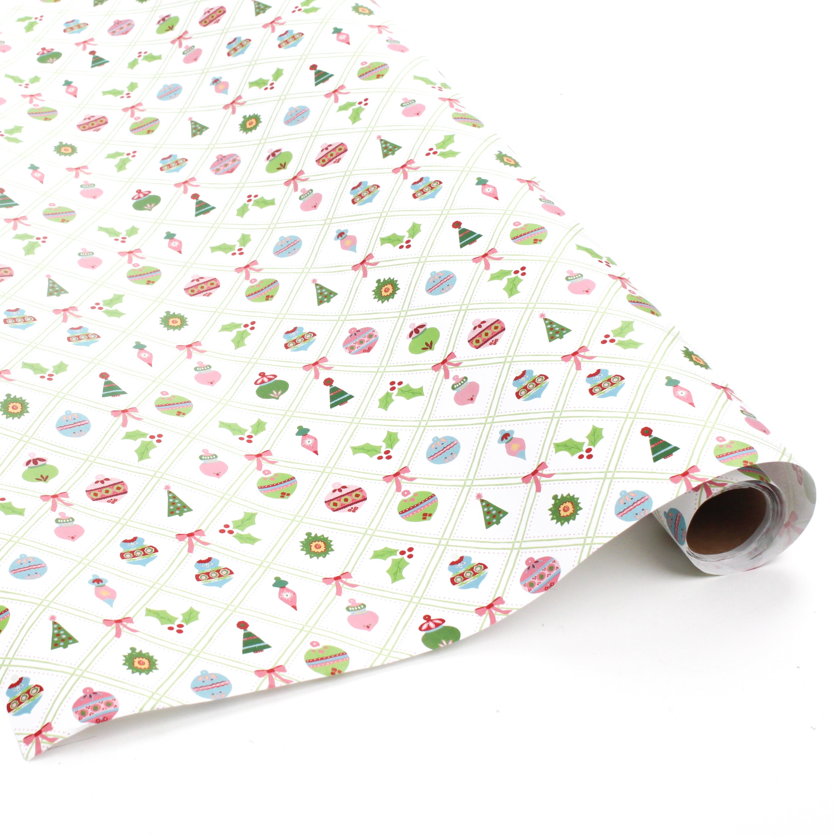 Roll of white wrapping paper with colorful Christmas ornament and holly pattern.