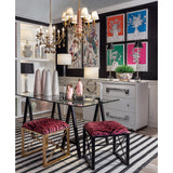 A pink pagoda chandelier hanging above a dining table.