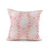 Pink outdoor pillow with pineapple motif and tropical charm.