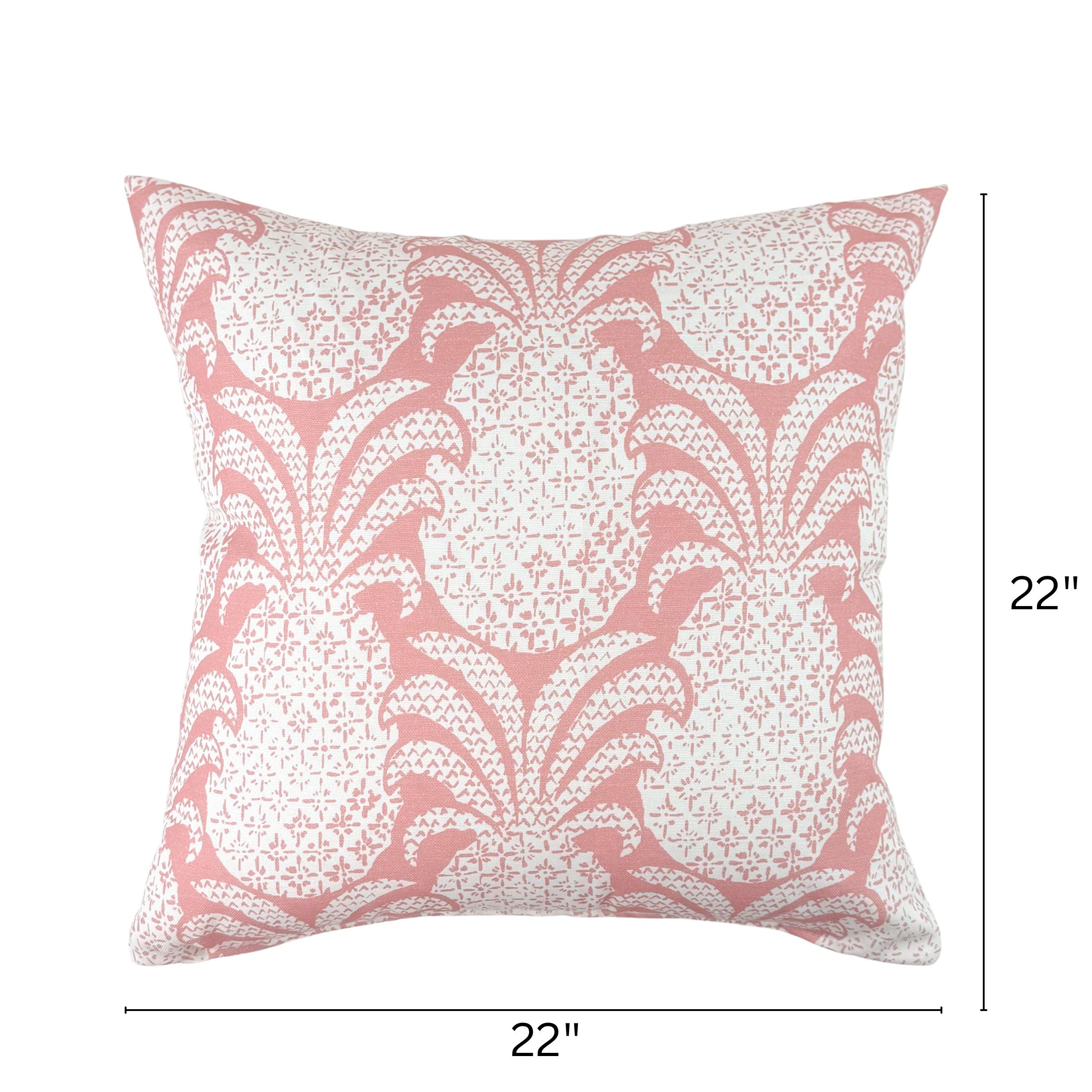 Pink outdoor pillow with pineapple pattern, 22 by 22 inches.