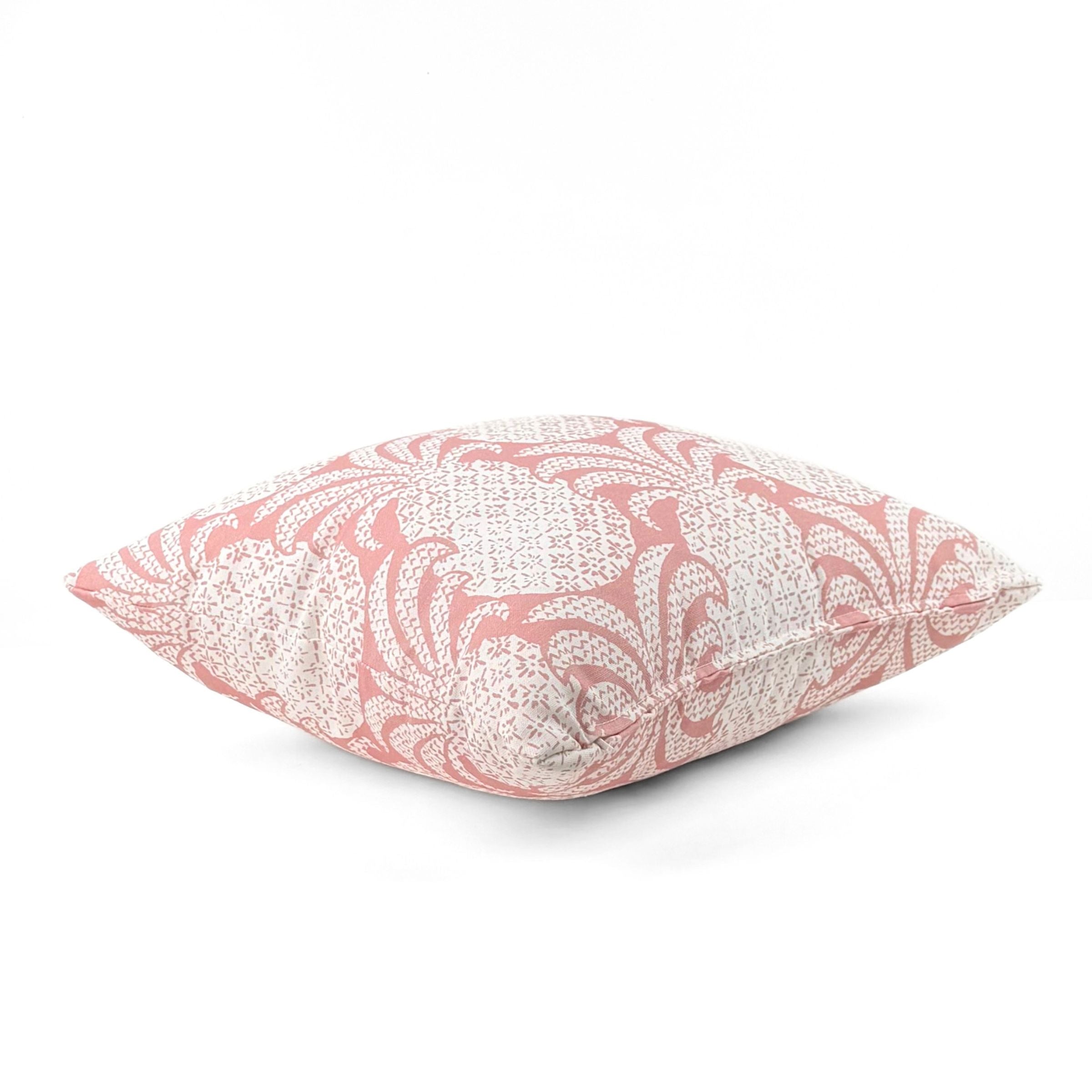 Pink outdoor pillow with elegant pineapple-inspired tropical pattern.