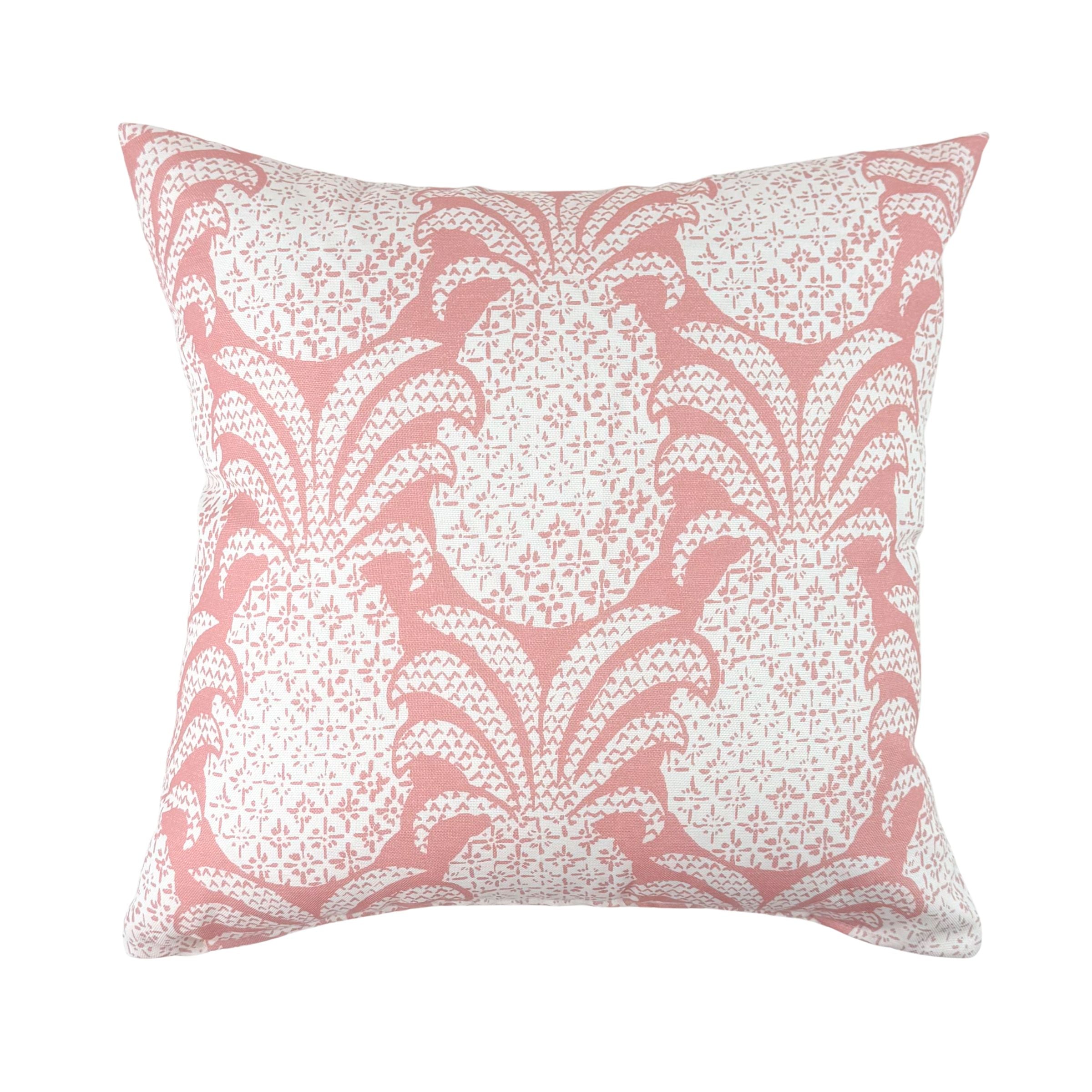 Pink outdoor pillow featuring a charming pineapple-inspired pattern.
