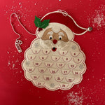A santa shaped felt advent calendar against a red background. 