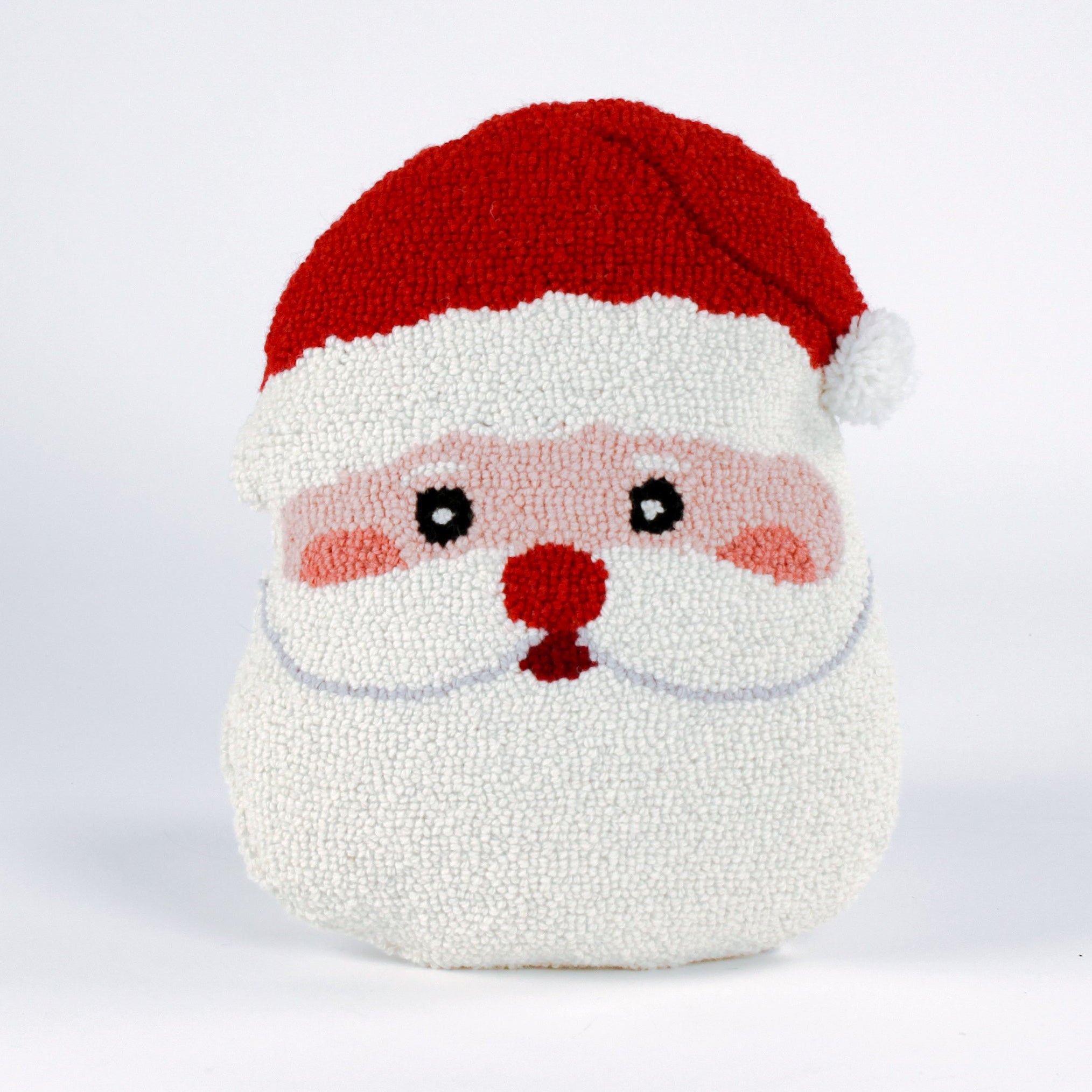 Santa-shaped hooked wool christmas pillow with a hooked texture, featuring Santa’s face with rosy cheeks, a red nose, and a bright red hat with a white pom-pom.