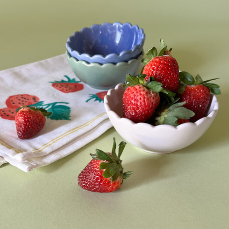 scalloped bowls with strawberries