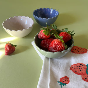 scalloped ceramic bowls with strawberries