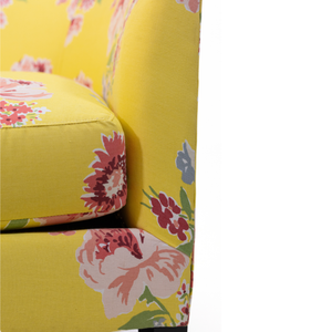 a yellow vintage floral loveseat