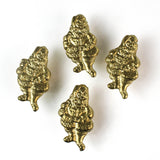Four gold santa Christmas napkin rings on a white background