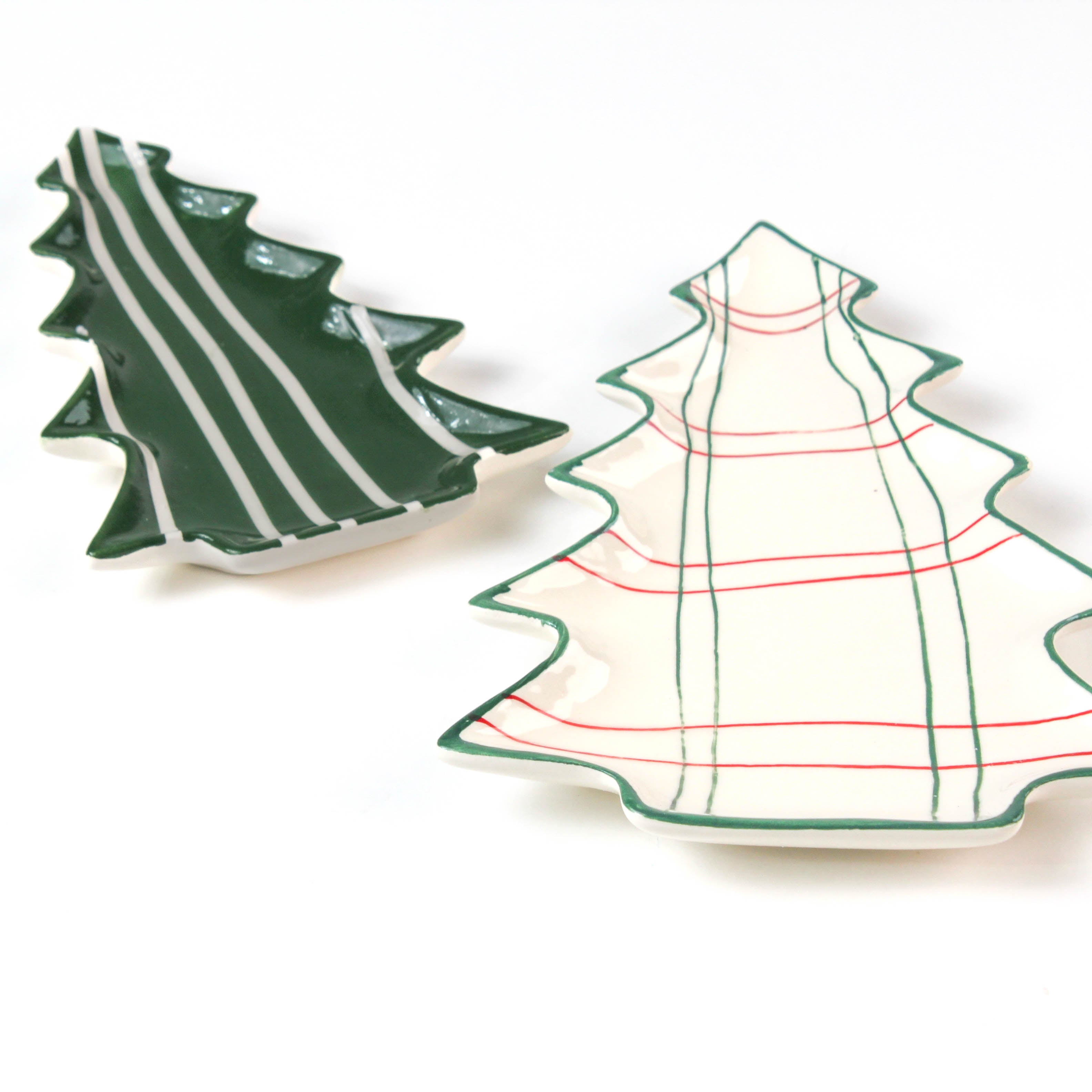 Two Christmas tree ceramic plates on a white background