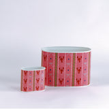 Empty duo of Lobster and Ribbons caddies in large and small on a green background
