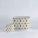 Two decorative containers with a festive pattern on a light gray background