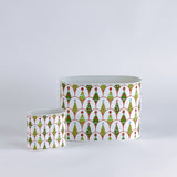 Two decorative containers with a festive pattern on a light gray background