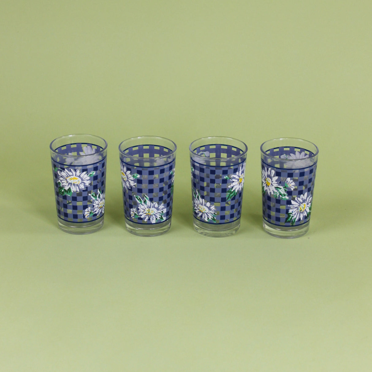 a vintage tiffany and co pitcher with floral motifs and filled with tulips. 