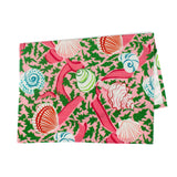 a pink tea towel with colored shells and pink ribbons against a white background 