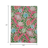 a pink tea towel with colored shells and pink ribbons against a white background 