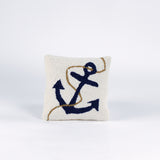 A white pillow featuring a dark blue anchor design with a tan rope wrapped around it.