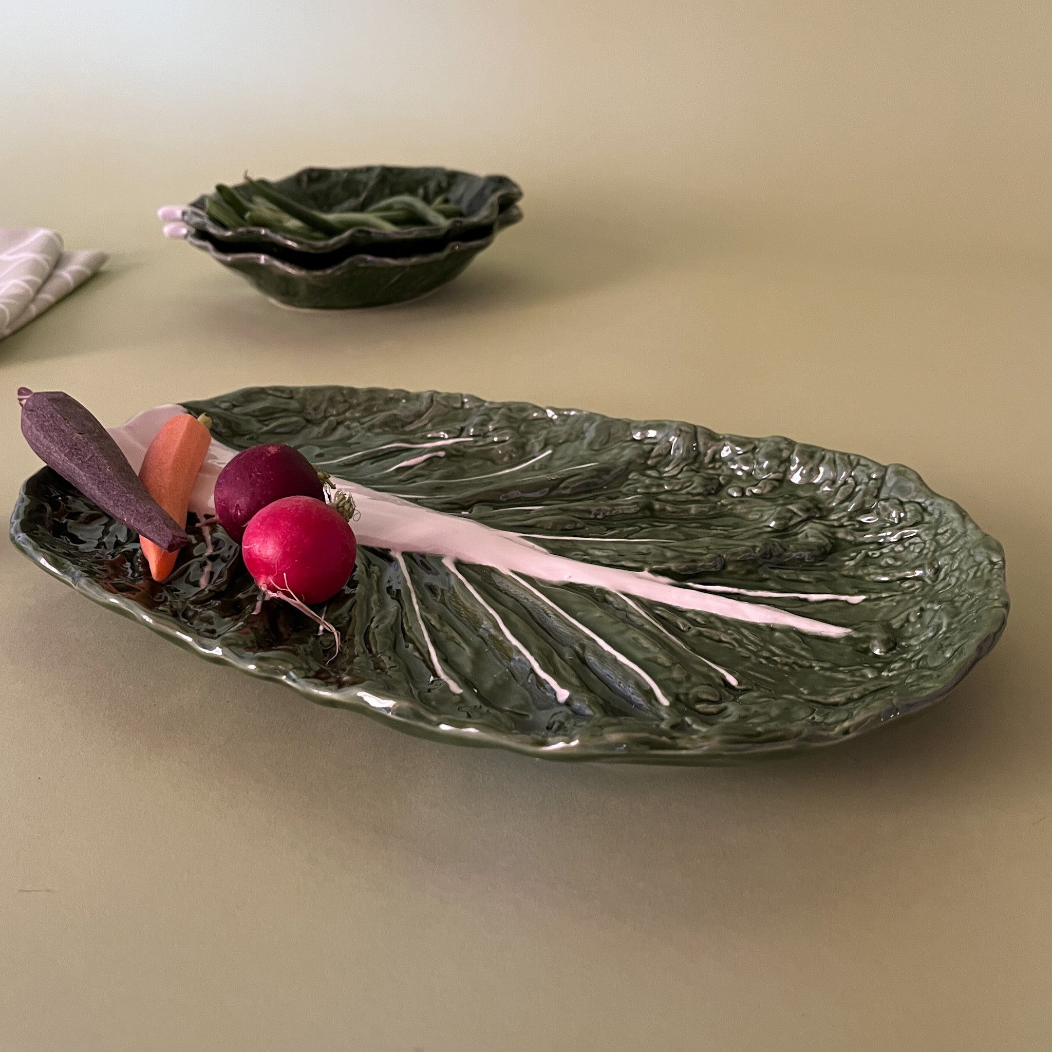 a side view of a ceramic cabbage serving platter