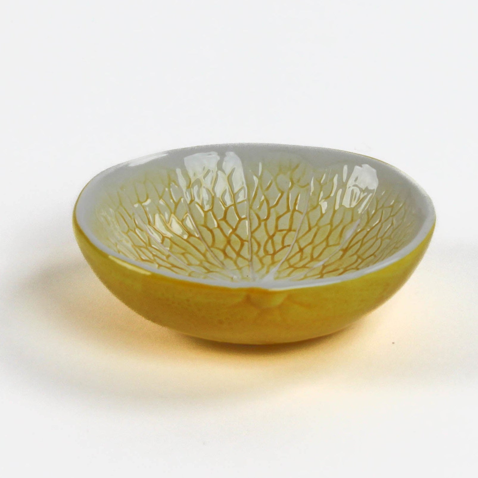 a lemon shaped ceramic bowl