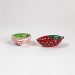 Two small ceramic bowls with a strawberry design and shape on a white background