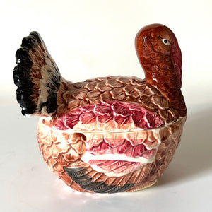 the side angle of a colourful vintage ceramic turkey centerpiece