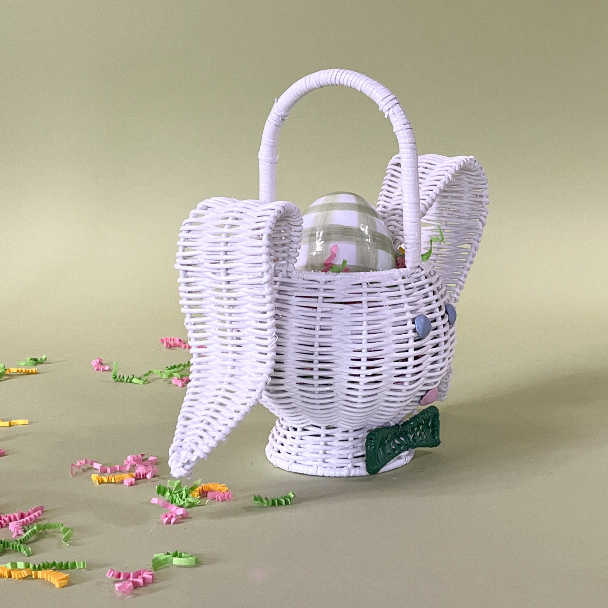 white rattan bunny easter basket with egg in it side view