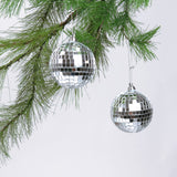 2 hanging mini silver disco ball christmas ornaments on a white background