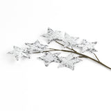 Decorative branch with star-shaped leaves on a white background