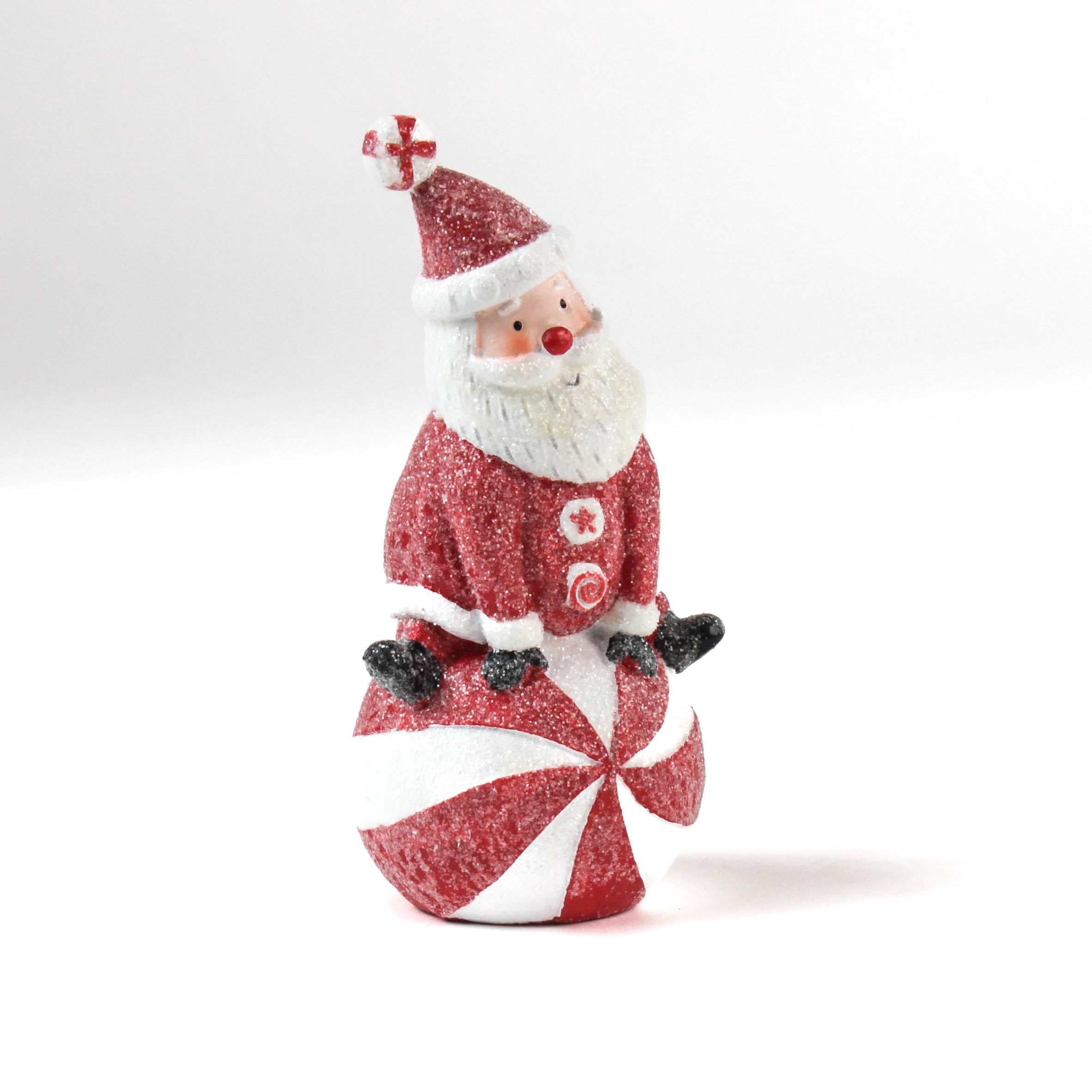 Decorative Santa table decoration on a candy cane with a white background