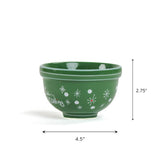 Green ceramic Christmas bowl with white snowflake design, shown on a white background with dimensions 4.5 inches wide and 2.75 inches tall.