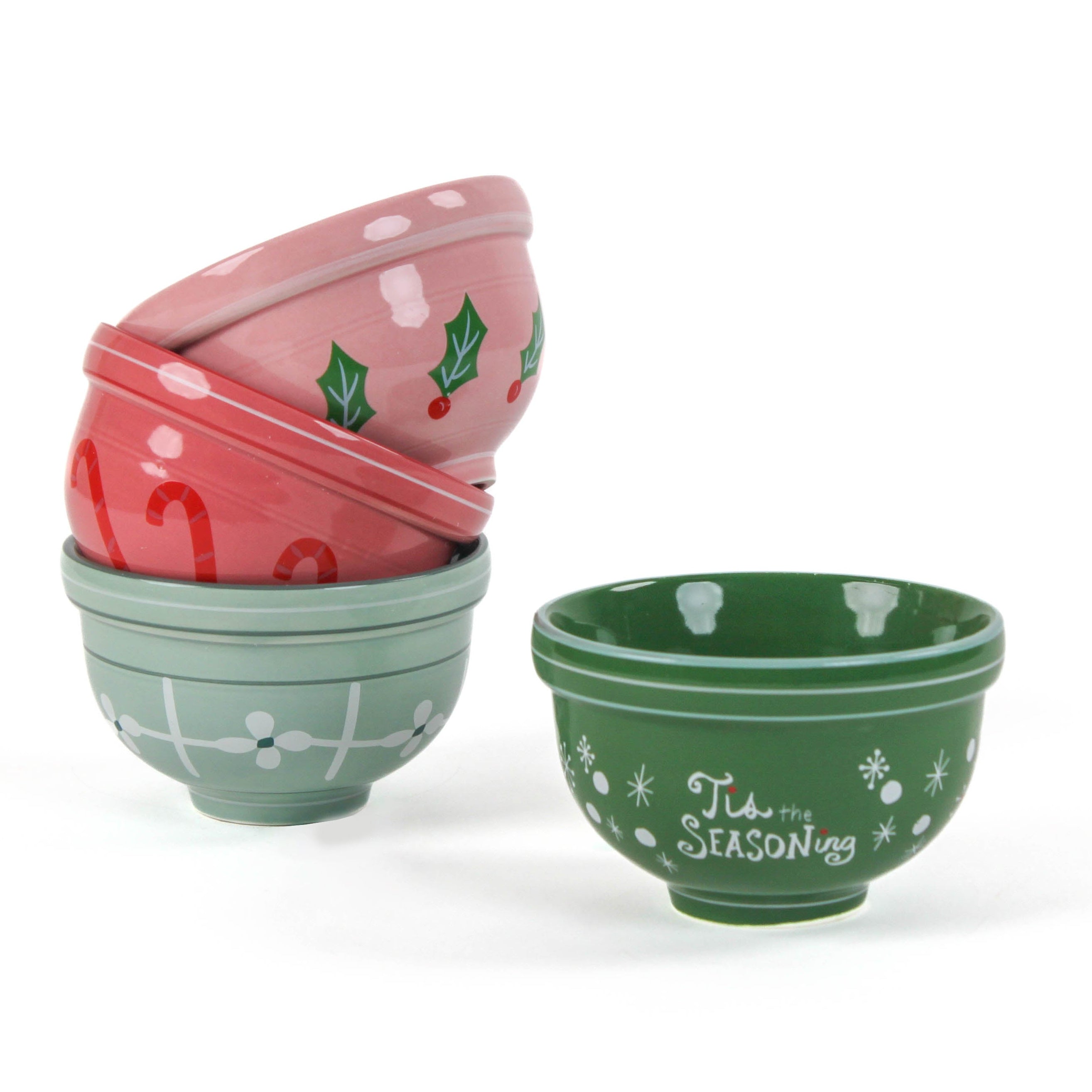 Four small ceramic christmas bowls against a white background. 