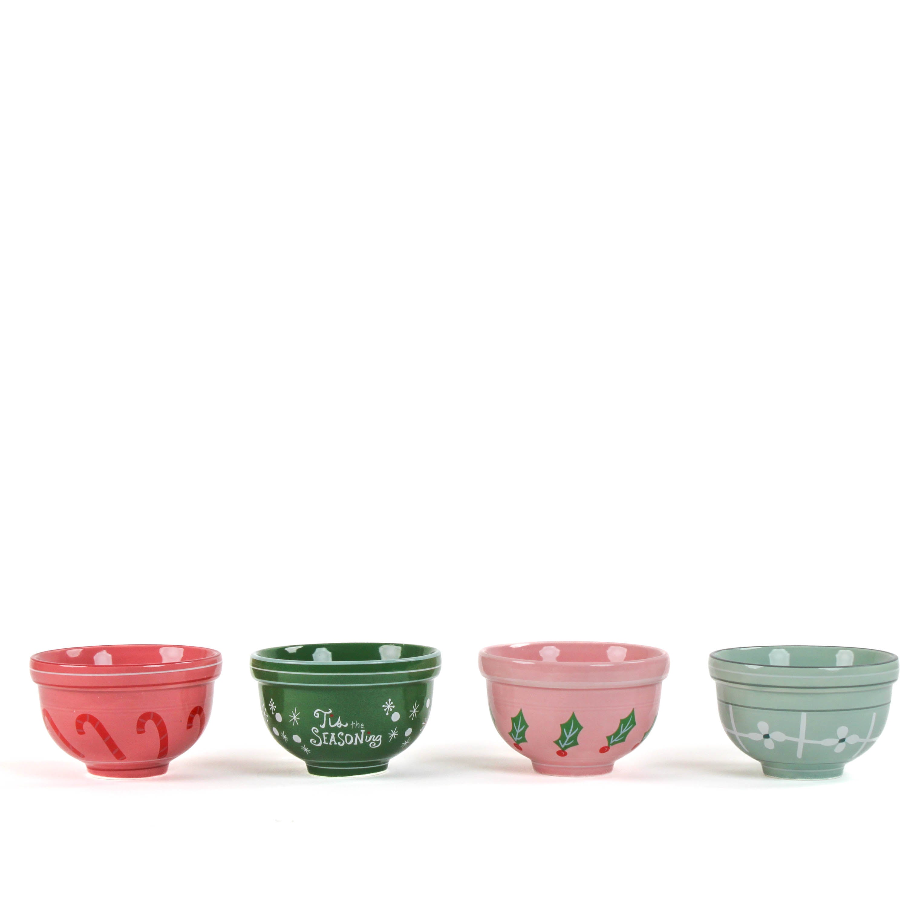 four small ceramic christmas bowls against a white background. 