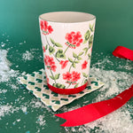 Hand-painted glass with red geraniums and a red band around the base