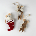 Three felt mouse ornaments, one peeking out of a red Christmas stocking and two wearing white snowflake costume frames, shown lying flat.