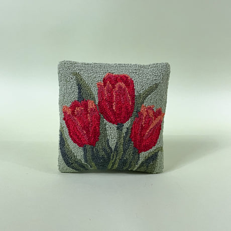 green spring pillow with red tulips