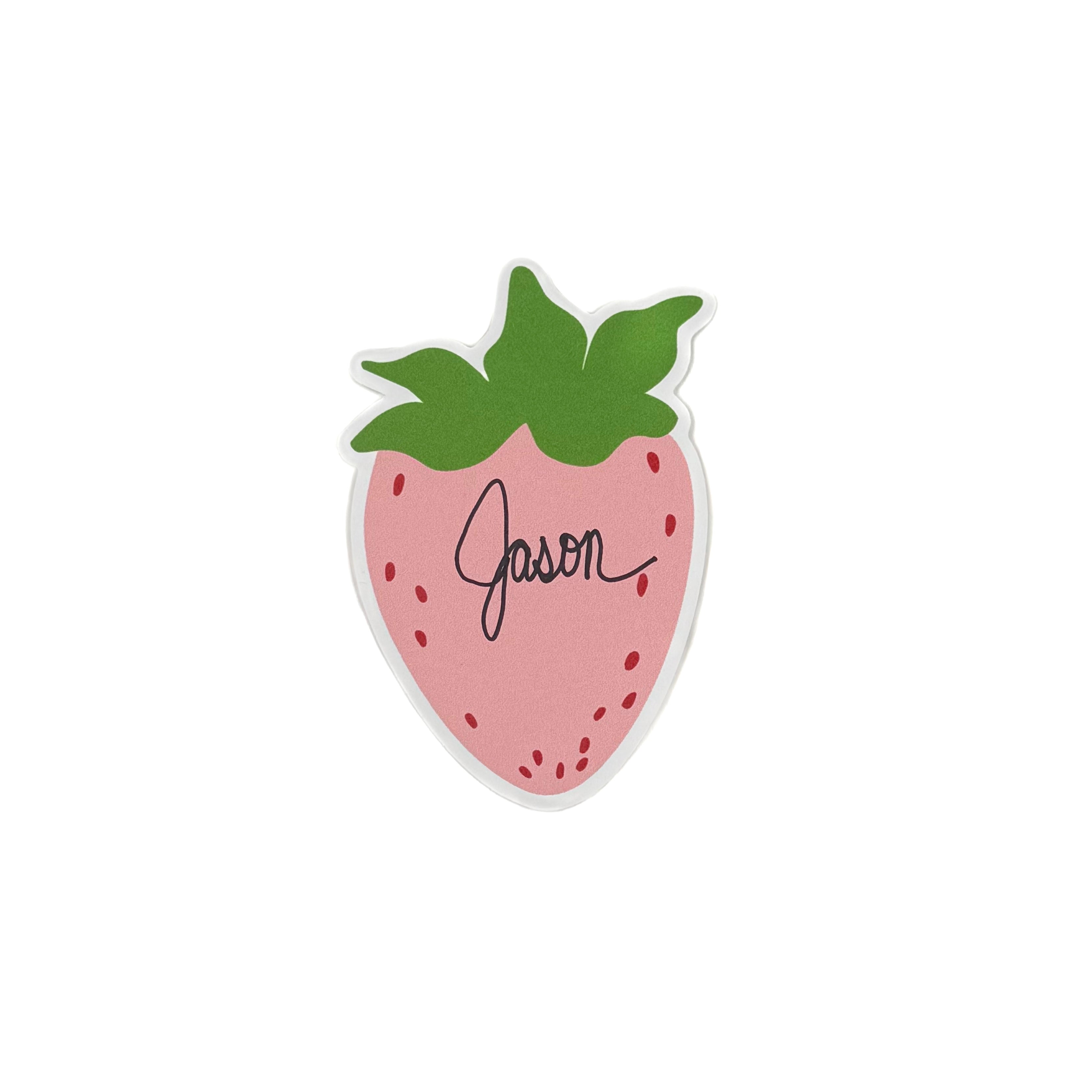 a strawberry-shaped spring paper place card designed by Madcap Cottage with the name Jason written in the center on a white background