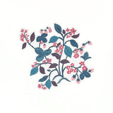 A strawberry themed die cut paper placemats featuring floral vines leaves and pink strawberries on a white background.