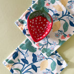 strawberry hill floral cloth cocktail napkins with strawberry accent dish