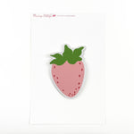 a strawberry-shaped spring paper place card designed by Madcap Cottage  on a white background