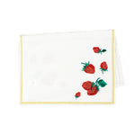 a white strawberry tea towel with a strawberries in the corner and a yellow border around the edges resting on a white background. 