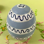 a blue striped arge decorative easter eggs