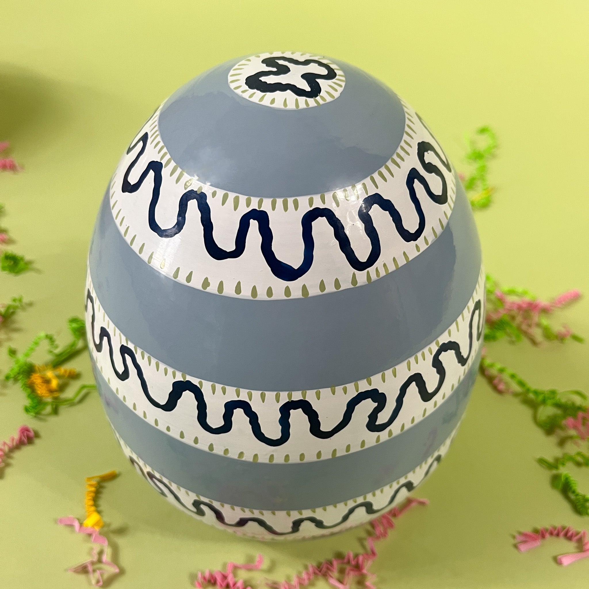 a blue striped arge decorative easter eggs