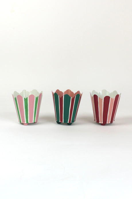 three striped cachepots in shades of pink, red and green from madcap cottage