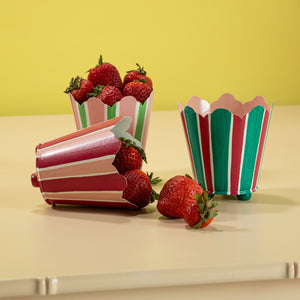three striped cachepots in shades of pink, red and green from madcap cottage