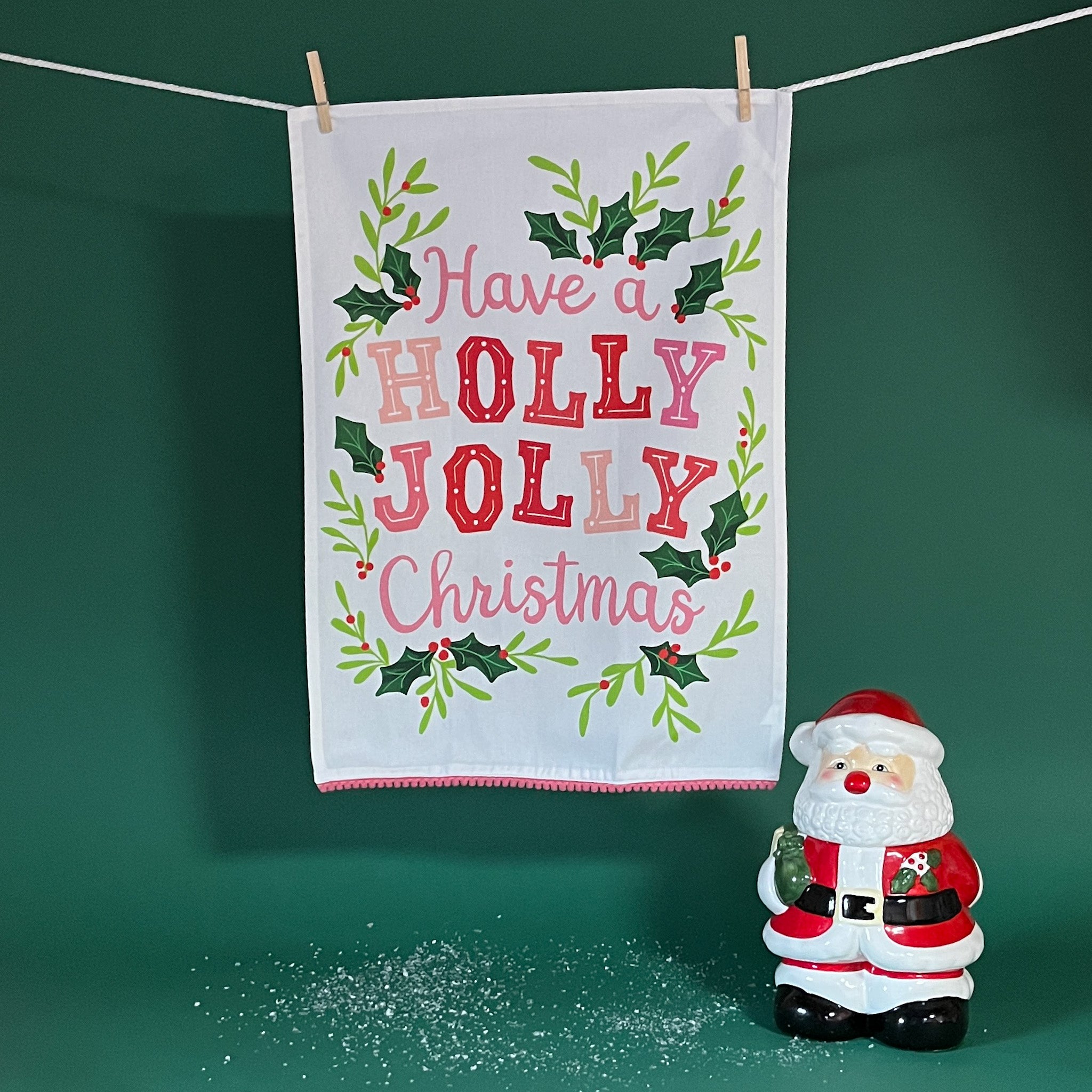 White Christmas tea towel that says "Have a holly jolly Christmas"