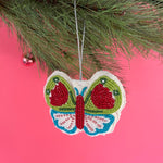 A beaded butterfly felt Christmas ornament