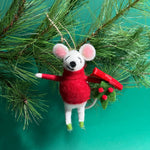 A felt mouse ornament wearing a red sweater and holding a green wreath with red berries and a bow